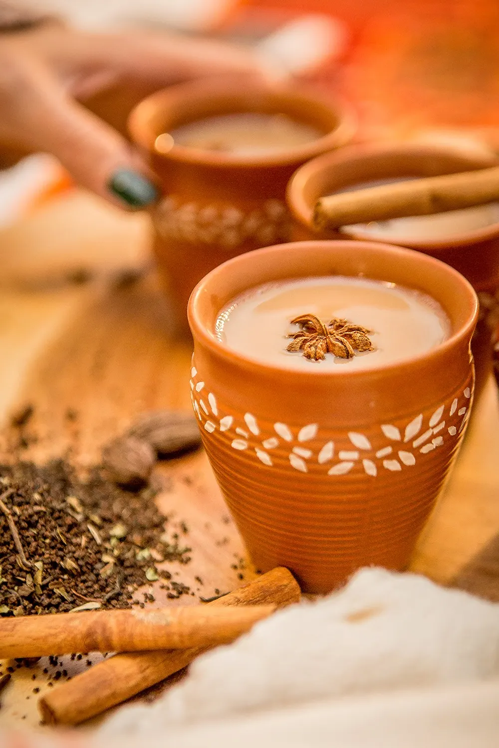 Chai in clay cups with spices