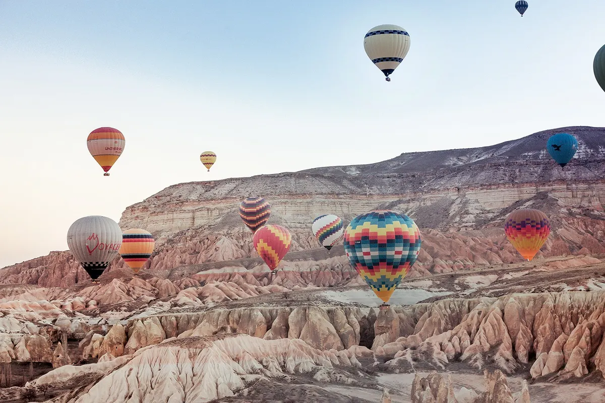 Hot air balloons over Cappadocia at sunrise
